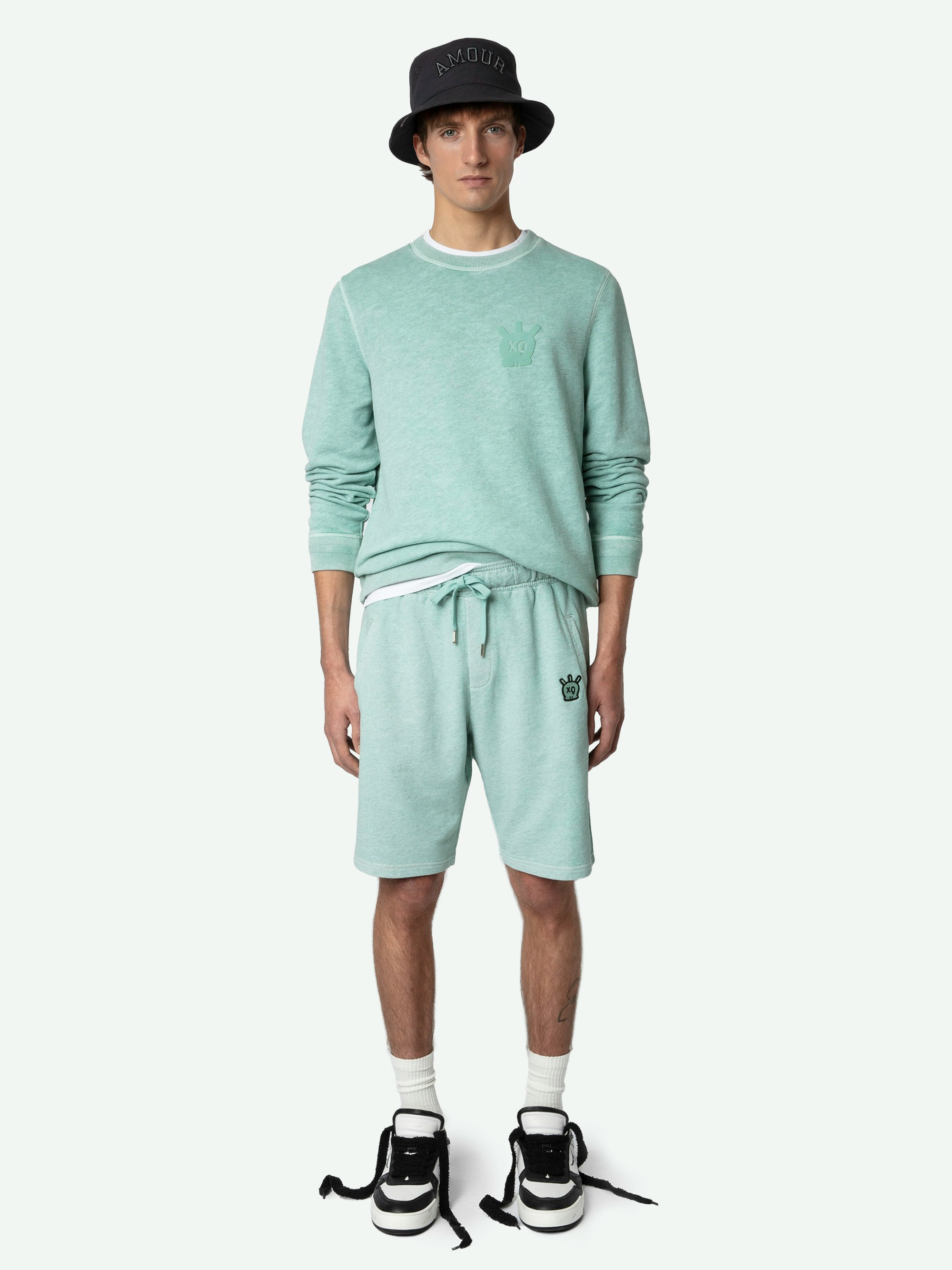 Party Short - Light blue organic cotton shorts with pockets and XO Skull patch on the front.